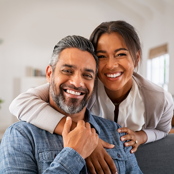 Mature indian couple hugging and looking at camera